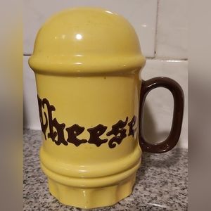 Vintage ceramic cheese shaker.